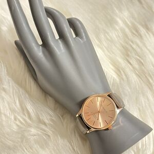 Elegant Rose Gold Women's Watch with Beige Strap